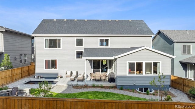 14423 Shasta Daisy Ln, Parker, CO 80134 - back of house with a fenced backyard, a patio area, and an outdoor fire pit
