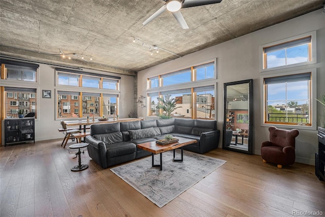 1925 W 32nd Ave Unit 404, Denver, CO 80211 - living room with hardwood / wood-style flooring, a ceiling fan, and a high ceiling