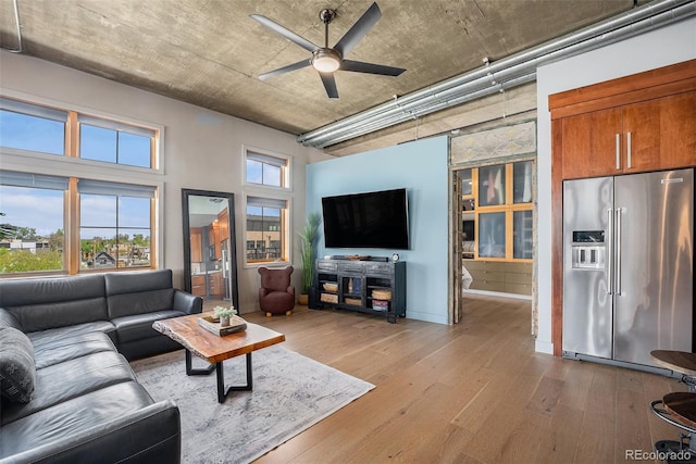 1925 W 32nd Ave Unit 404, Denver, CO 80211 - living area featuring light wood-type flooring and ceiling fan