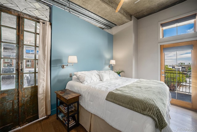 1925 W 32nd Ave Unit 404, Denver, CO 80211 - bedroom featuring wood finished floors, access to exterior, and french doors