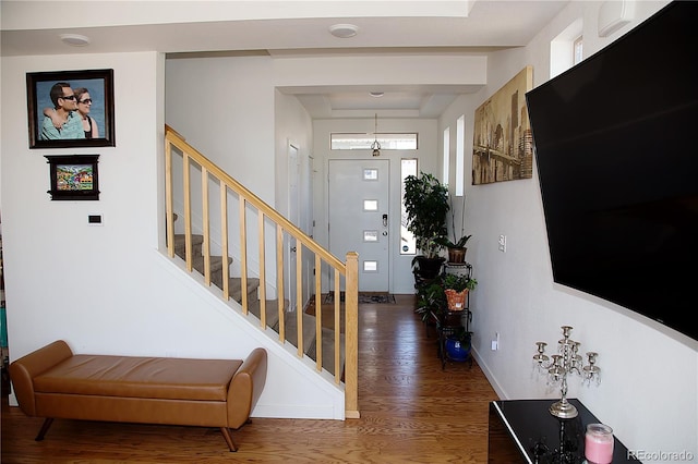 entrance foyer with baseboards, stairs, and dark wood finished floors