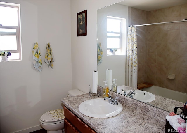 full bath featuring vanity, toilet, and a tile shower