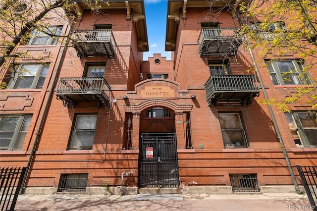 1475 N Humboldt St Unit 20, Denver, CO 80218 - view of building exterior featuring a fenced front yard
