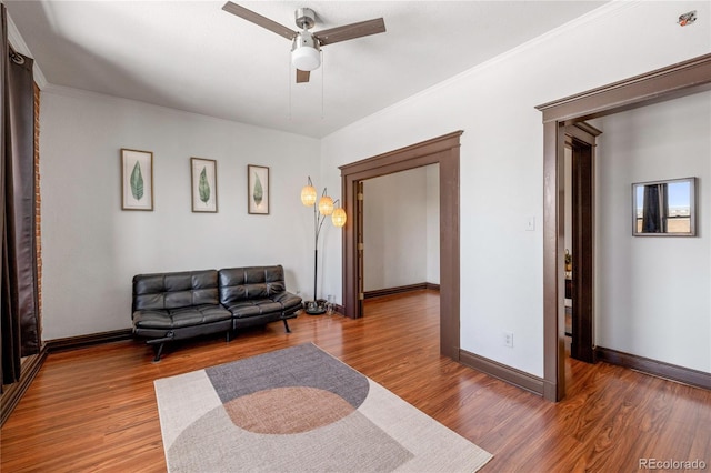 1475 N Humboldt St Unit 20, Denver, CO 80218 - living room featuring ceiling fan, wood finished floors, baseboards, and crown molding