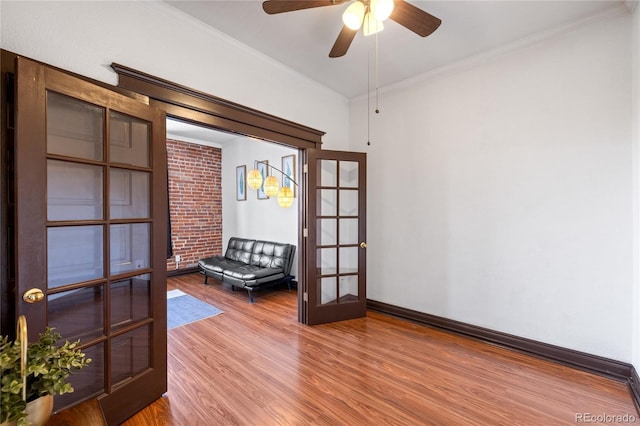1475 N Humboldt St Unit 20, Denver, CO 80218 - sitting room with french doors, wood finished floors, a ceiling fan, ornamental molding, and baseboards