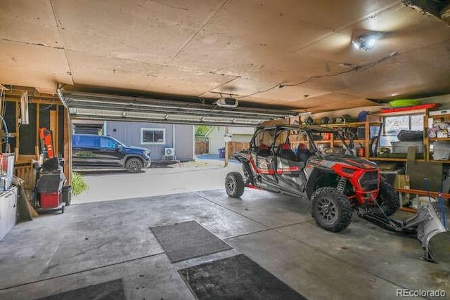 1027 S University Blvd, Denver, CO 80209 - garage featuring a garage door opener