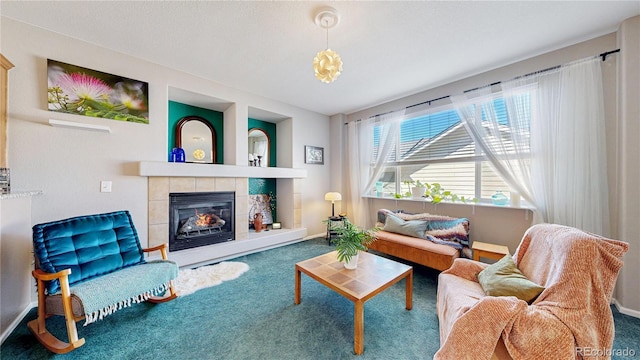 carpeted living area with a fireplace and baseboards