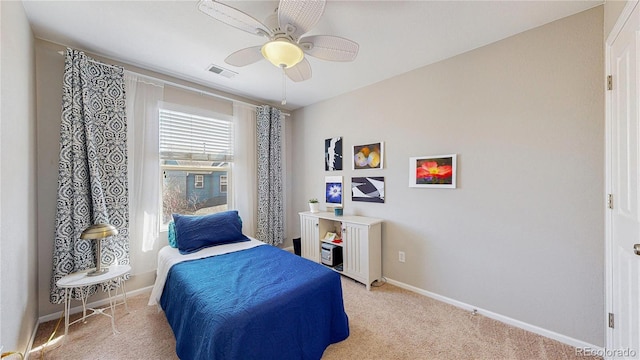 bedroom featuring visible vents, light carpet, baseboards, and a ceiling fan