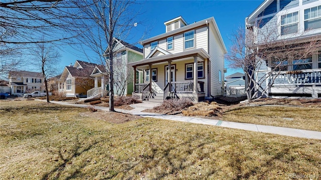 traditional style home featuring a porch, a front yard, and a residential view