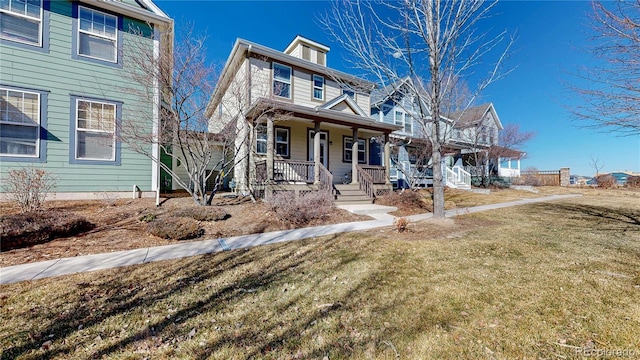 view of front of house with covered porch and a front yard