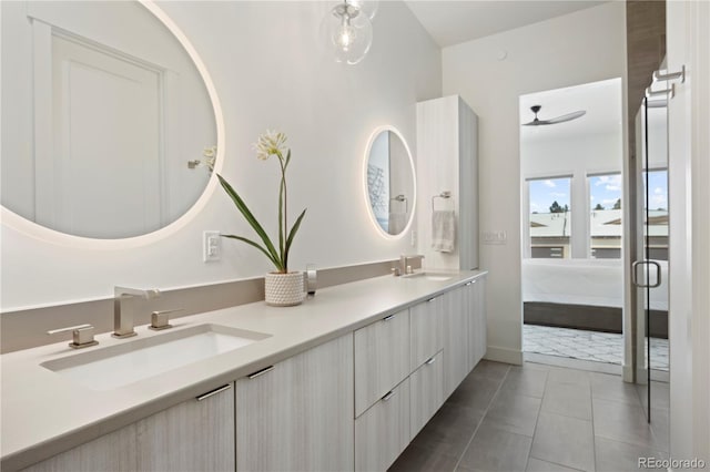 bathroom featuring tile patterned flooring, vanity, and ceiling fan