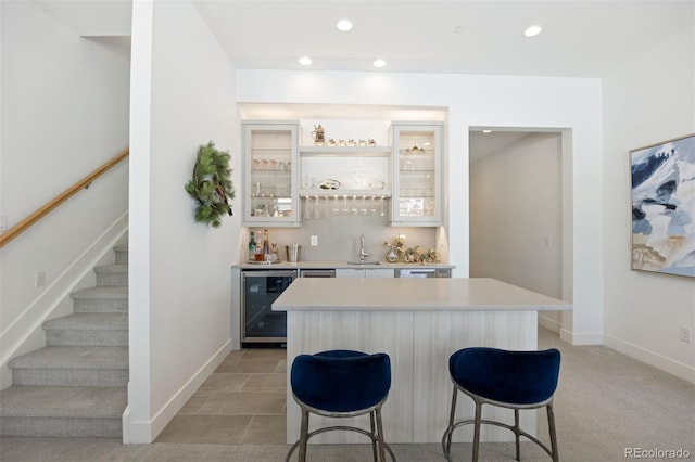 bar with beverage cooler and sink