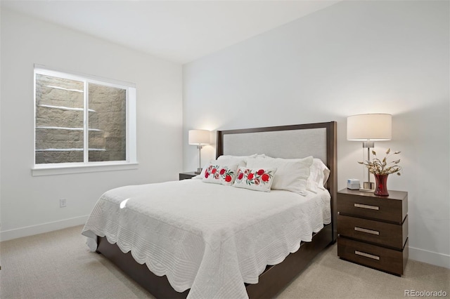 bedroom with light colored carpet