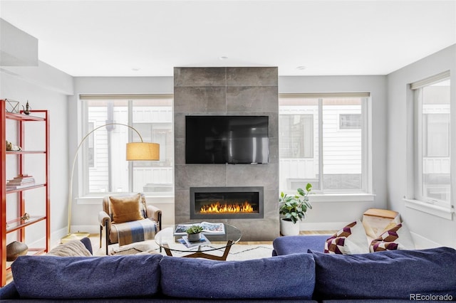3156 W 20th Ave, Denver, CO 80211 - living area featuring a fireplace and baseboards