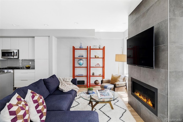 3156 W 20th Ave, Denver, CO 80211 - living room with a tiled fireplace and light wood finished floors