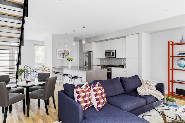 3156 W 20th Ave, Denver, CO 80211 - living area featuring light wood finished floors and recessed lighting