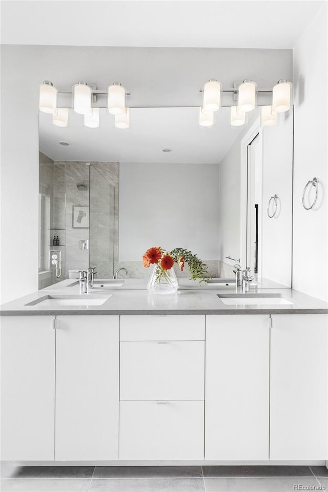 3156 W 20th Ave, Denver, CO 80211 - bathroom with double vanity, a shower stall, and tile patterned flooring