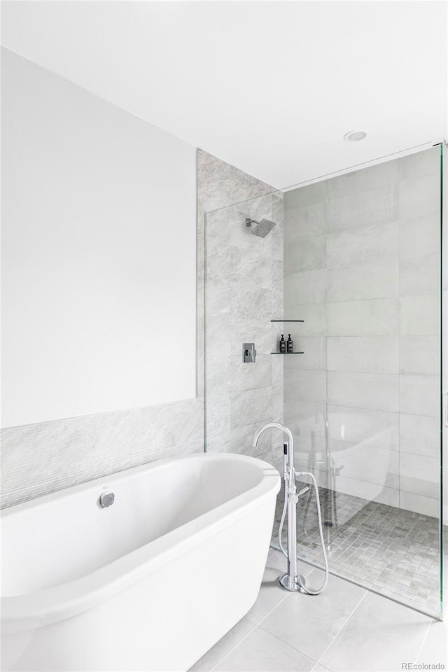 3156 W 20th Ave, Denver, CO 80211 - bathroom with a freestanding bath, a tile shower, and tile patterned floors