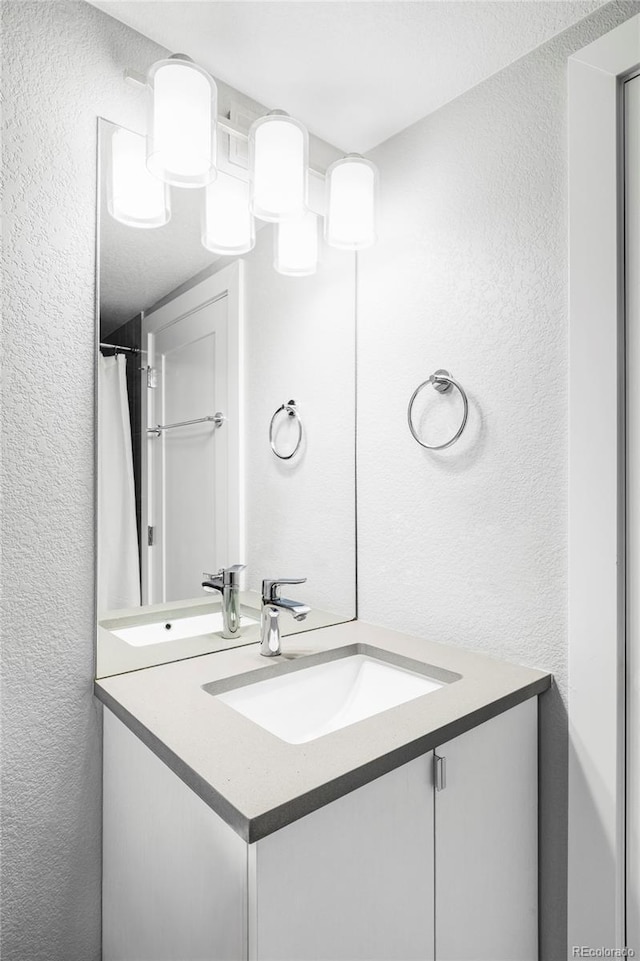 3156 W 20th Ave, Denver, CO 80211 - full bathroom with a textured wall and vanity