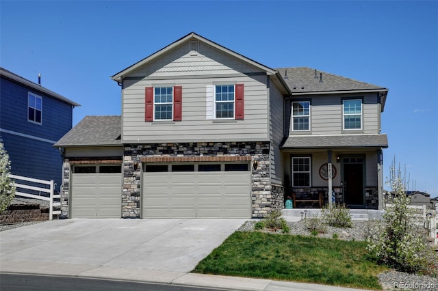5837 High Timber Cir, Castle Rock, CO 80104 - craftsman-style home featuring driveway, stone siding, an attached garage, fence, and roof with shingles