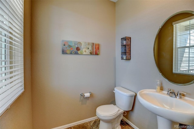 5837 High Timber Cir, Castle Rock, CO 80104 - bathroom with tile patterned flooring, baseboards, a sink, and toilet