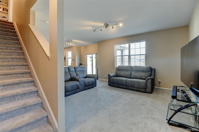 5837 High Timber Cir, Castle Rock, CO 80104 - living area featuring baseboards, carpet flooring, rail lighting, and stairs