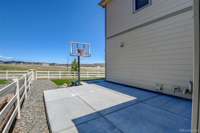 5837 High Timber Cir, Castle Rock, CO 80104 - view of basketball court with fence and a healthy amount of sunlight