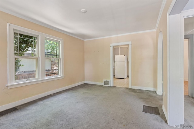 712 Locust St, Denver, CO 80220 - spare room with carpet, ornamental molding, and arched walkways