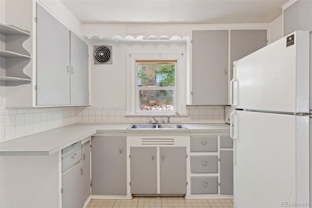 712 Locust St, Denver, CO 80220 - kitchen with freestanding refrigerator, light countertops, backsplash, and open shelves