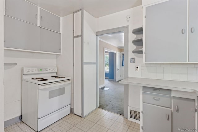 712 Locust St, Denver, CO 80220 - kitchen featuring white electric range, light countertops, light colored carpet, open shelves, and gray cabinets