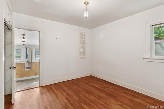 712 Locust St, Denver, CO 80220 - empty room with wood finished floors and baseboards