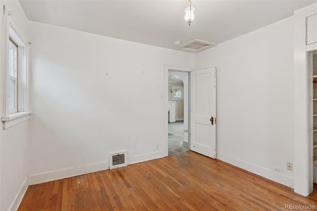 712 Locust St, Denver, CO 80220 - unfurnished room featuring attic access and hardwood / wood-style floors