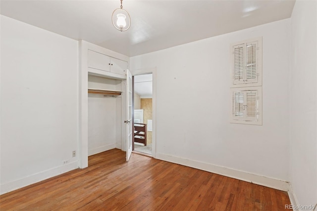 712 Locust St, Denver, CO 80220 - unfurnished bedroom with light wood-style floors and a closet