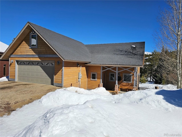 view of front of property with a detached garage