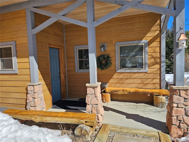 entrance to property with covered porch