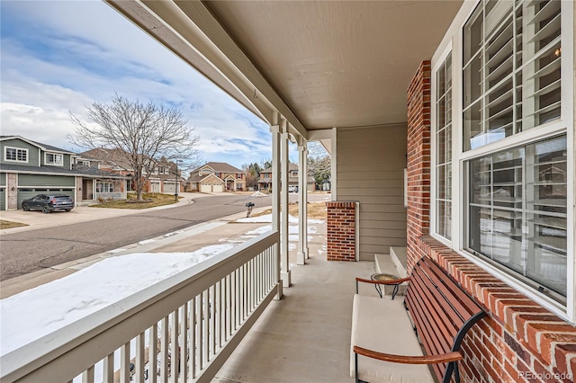 balcony featuring a porch and a residential view