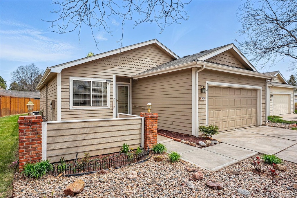 900 Arbor Ave Unit 4, Fort Collins, CO 80526 - ranch-style house featuring an attached garage, concrete driveway, and fence