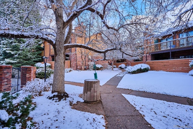 view of yard layered in snow