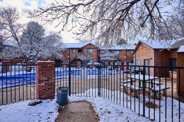 view of snow covered gate