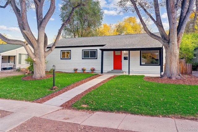 ranch-style home featuring a front yard