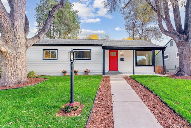 single story home featuring a front yard