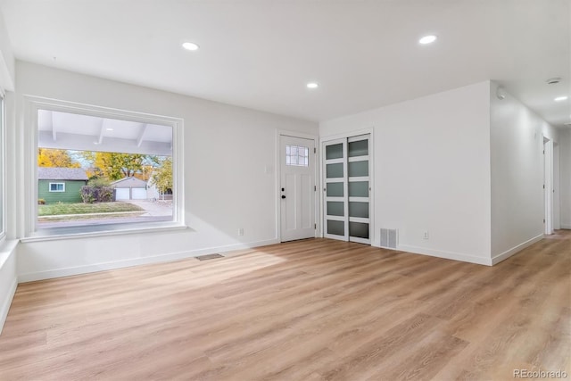 entryway with light hardwood / wood-style floors