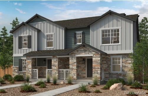 24151 E 52nd Ave, Aurora, CO 80019 - view of front facade with board and batten siding, stone siding, and covered porch