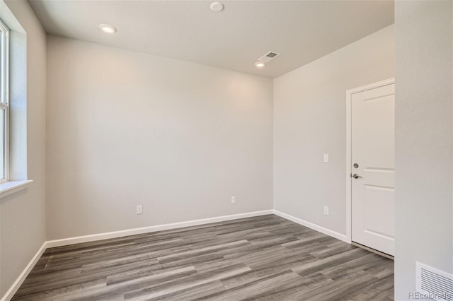 empty room with wood-type flooring