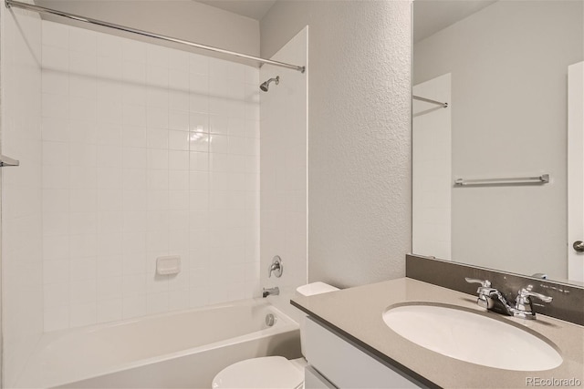 full bathroom featuring vanity, toilet, and tiled shower / bath combo