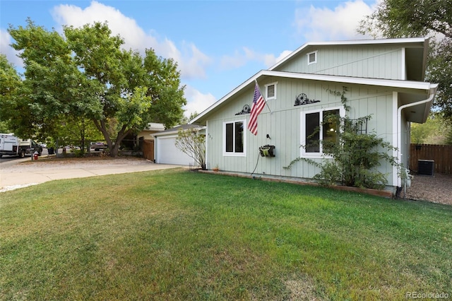 view of front facade with a garage and a front lawn