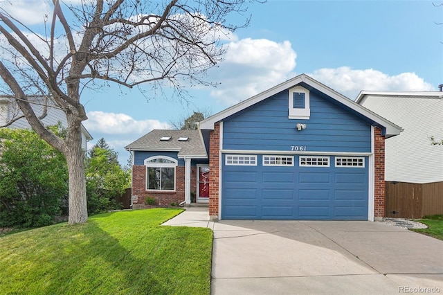 traditional-style house with driveway, brick siding, and an attached garage