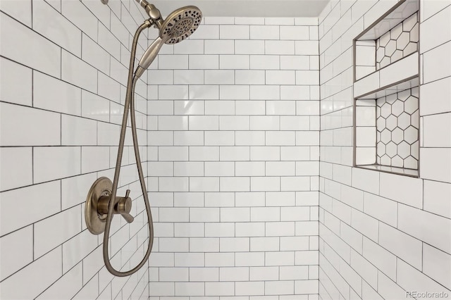 full bathroom with a tile shower