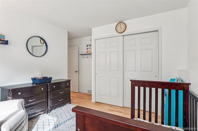 bedroom featuring a closet and wood finished floors