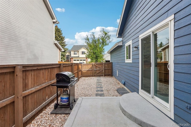 view of patio with a fenced backyard and grilling area